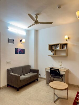 Living Room in 1 RK Apartment at Nimbus The Golden Palm, Sector 168 – for Rent