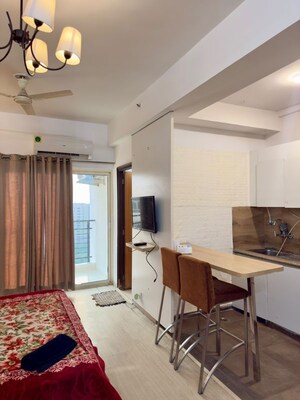 Living Room in 1 RK Apartment at Nimbus The Golden Palm, Sector 168 – for Rent