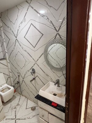 Bathroom in 3 BHK Builder Floor at Dwarka Mor – for Rent