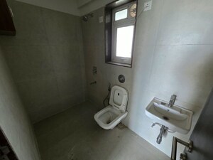 Bathroom in 1 BHK Apartment at Puranik City, Kasarvadavali – for Rent