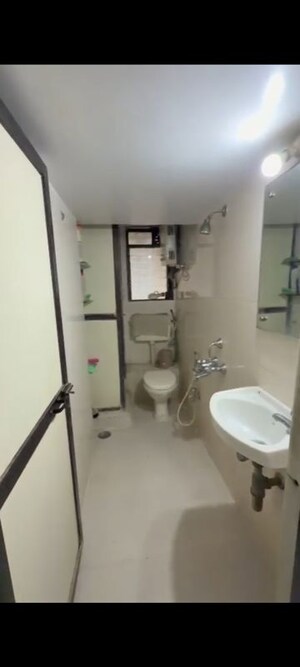 Bathroom in 1 BHK Apartment at Azad Nagar Sangam CHS, Andheri West – for Rent