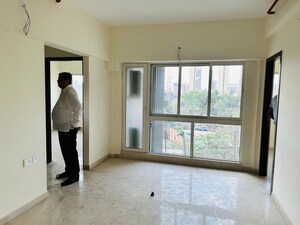Room in 2 BHK Apartment at Omkar Signet, Malad East – for Rent