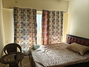 Bedroom in 1 BHK Apartment at Ruparel Elara, Kandivali West – for Rent