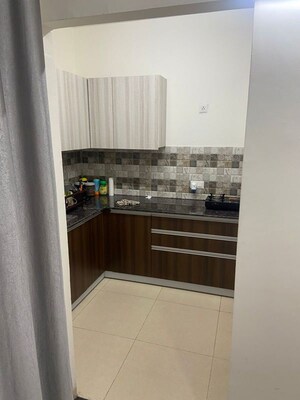 Kitchen in 2 BHK Builder Floor at Maya Green Lotus Utsav, International Airport Road – for Rent