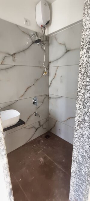 Bathroom in 2 BHK Apartment at Raunak Unnathi Woods Supreme, Ghodbunder Road – for Rent