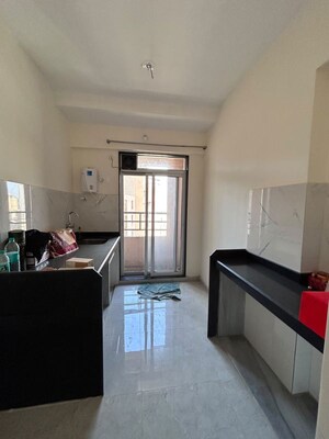 Kitchen in 1 BHK Apartment at Mahavir Kalpavruksha, Ghodbunder Road – for Sale