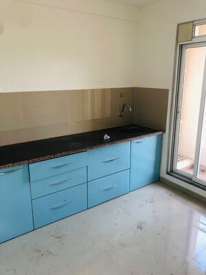 Kitchen in 2 BHK Apartment at Puranik Rumah Bali, Ghodbunder Road – for Rent