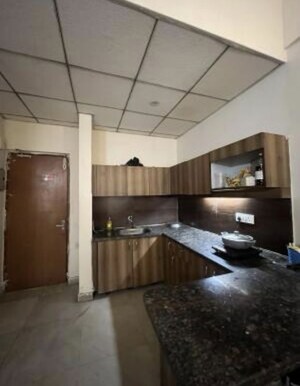 Living Room in Studio Apartment at Paramount Golf Foreste Apartments, Zeta I Greater Noida – for Rent