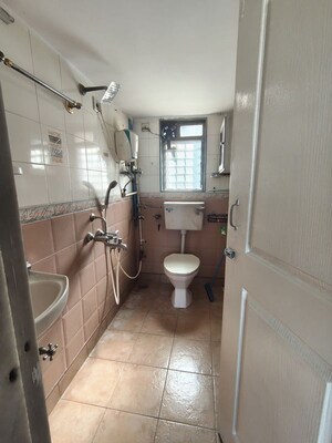 Bathroom in 2 BHK Apartment at Prakash Tower, Matunga – for Rent