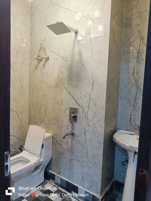 Bathroom in 4 BHK Builder Floor at Dwarka Mor – for Rent