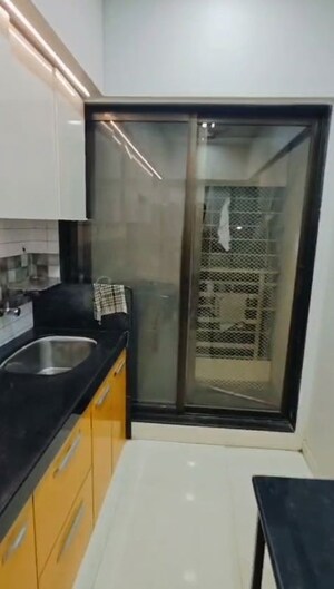 Kitchen in 2 BHK Apartment at Andheri CHS, Andheri West – for Rent