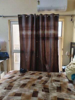 Living Room in 2.5 BHK Apartment at Aims Golf City, Sector 75 – for Rent