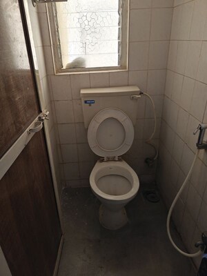 Bathroom in 2 BHK Apartment at Coronet Building, Kandivali East – for Rent