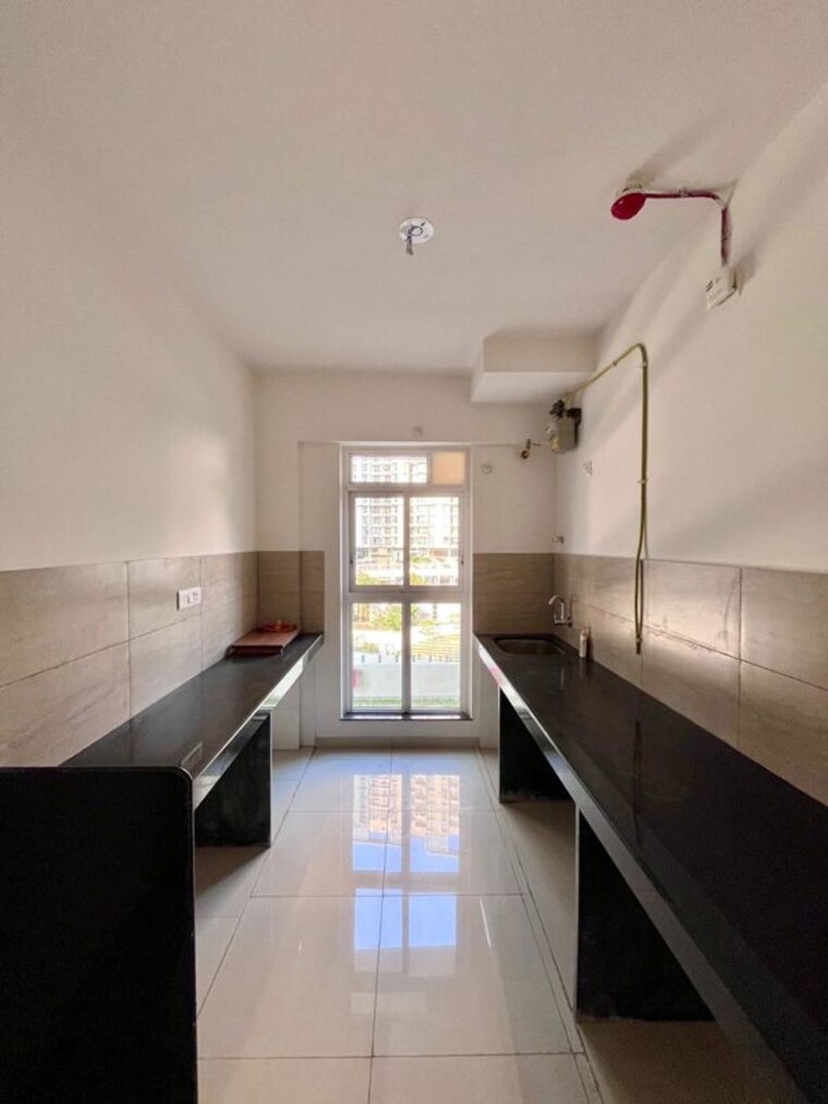 Kitchen, godrej-emerald 2 Bedroom 1000 Sq.Ft. Apartment In Ghodbunder Road Thane 10729070