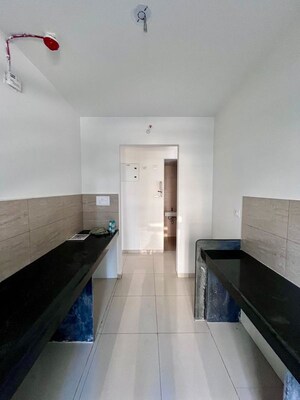 Kitchen in 2 BHK Apartment at Godrej Emerald, Ghodbunder Road – for Sale