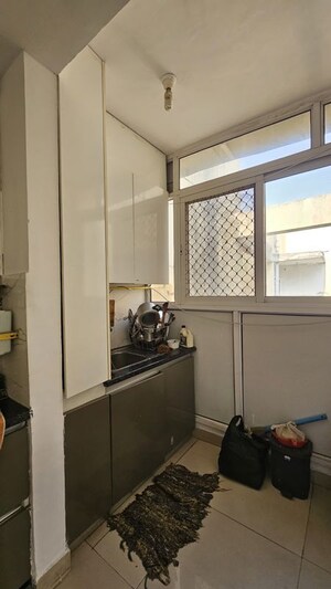 Kitchen in 2 BHK Apartment at Amrapali Enchante, Tech Zone 4 Greater Noida – for Rent