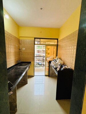 Kitchen in 1 BHK Apartment at Mayfair Vishwaraja, Titwala – for Sale