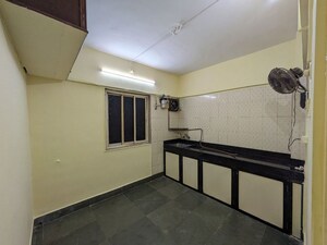 Kitchen in 2 BHK Apartment at Shri Bimla Apartment, Andheri East – for Sale