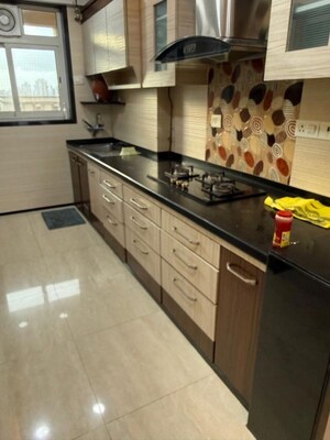 Kitchen in 3 BHK Apartment at Hiranandani Tribeca, Ghodbunder Road – for Rent