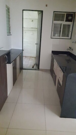 Kitchen in 2 BHK Apartment at Karan Sara, Baner – for Rent