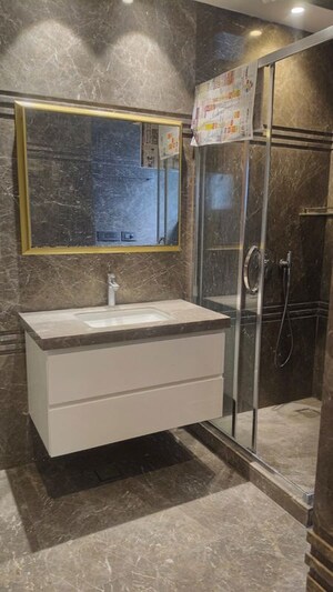 Bathroom in 4 BHK Builder Floor at Chirag Enclave – for Rent