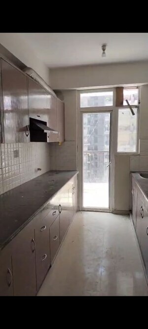 Kitchen in 4 BHK Apartment at Windsor Premium Tower, Raj Nagar Extension – for Rent