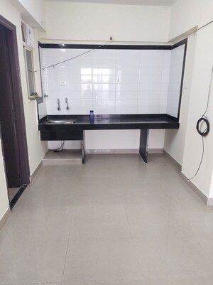 Kitchen in 2 BHK Apartment at Mittal Arcvista, Dhanori – for Rent