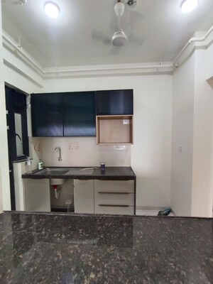 Kitchen in 2 BHK Apartment at Mahindra Nestalgia, Pimpri – for Rent