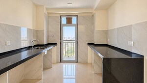 Kitchen in 3 BHK Apartment at Ruparel Ariana, Parel – for Sale