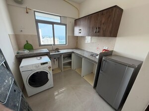 Kitchen in 1.5 BHK Apartment at Piramal Vaikunth, Balkum Pada – for Rent
