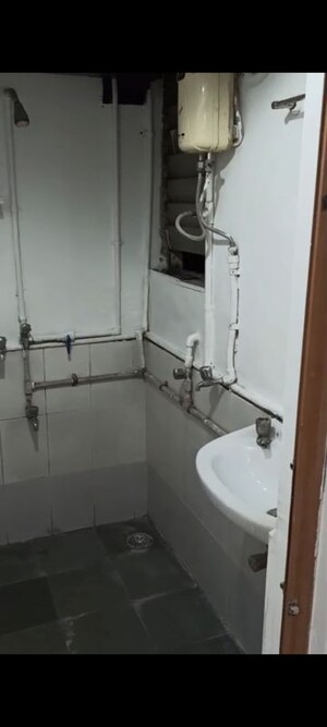 Bathroom in 1 BHK Apartment at Pragati Kavya Residency, Vile Parle East – for Rent