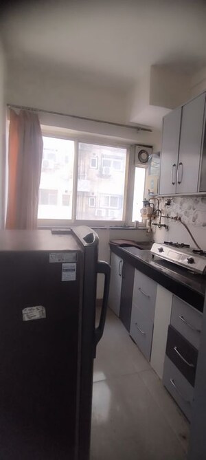 Kitchen in Studio Apartment at DLF Capital Greens Phase I And II, Moti Nagar – for Rent