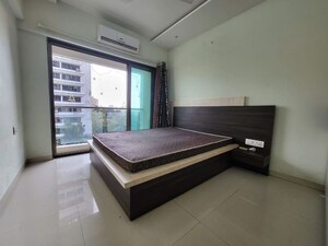 Bedroom in 2 BHK Apartment at Cosmopolis Tower, Andheri West – for Rent