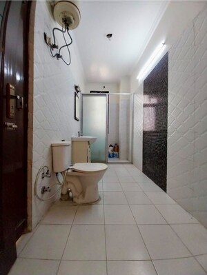 Bathroom in 4 BHK Builder Floor at Niti Khand I – for Rent