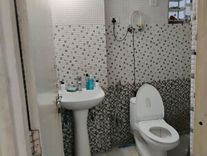 Bathroom in 2 BHK Apartment at Nilaya Greens, Raj Nagar Extension – for Rent