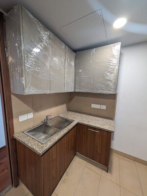 Kitchen in 2 BHK Apartment at Krisumi Waterfall Residences, Sector 36a – for Rent