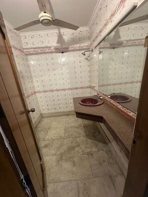 Bathroom in 4 BHK Builder Floor at Pamposh Enclave – for Sale