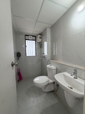 Bathroom in 1 BHK Apartment at Runwal Gardens, Dombivli East – for Rent