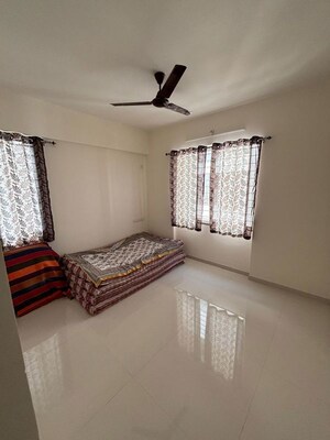 Bedroom in 2 BHK Apartment at Yogesh Gandharva Excellence, Moshi – for Rent