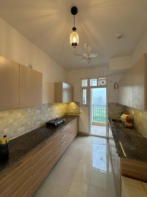 Kitchen in 3 BHK Apartment at ATS Homekraft Pious Hideaways, Sector 150 – for Rent