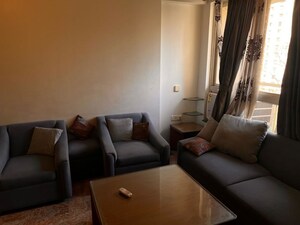 Living Room in 1 BHK Apartment at Hiranandani Estate Penrose, Thane West – for Rent