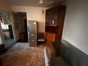 Living Room in 1 BHK Apartment at Hiranandani Estate Penrose, Thane West – for Rent