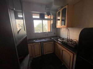 Kitchen in 1 BHK Apartment at Hiranandani Estate Penrose, Thane West – for Rent