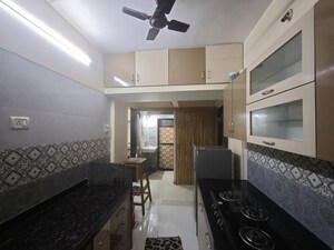 Kitchen in 1 BHK Apartment at Lok Upvan Apartment Phase 2, Vasant Vihar – for Sale