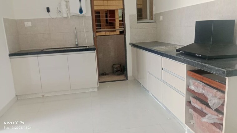Kitchen, gera-planet-of-joy 3 Bedroom 1000 Sq.Ft. Apartment In Kharadi Pune 10735746