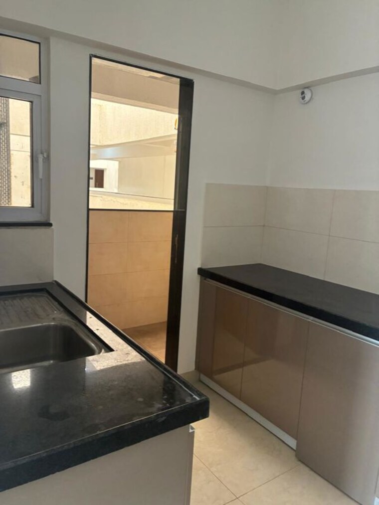 Kitchen, gera-world-of-joy 2 Bedroom 750 Sq.Ft. Apartment In Kharadi Pune 10736135