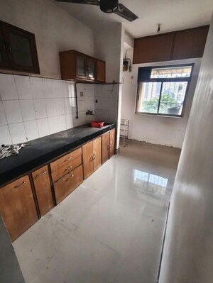 Kitchen in 2 BHK Apartment at Happy Valley, Manpada – for Rent
