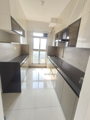 Kitchen in 2 BHK Apartment at Godrej Emerald, Ghodbunder Road – for Rent