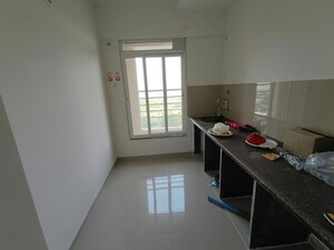 Kitchen in 2 BHK Apartment at Puranik Rumah Bali Phase III, Ghodbunder Road – for Rent