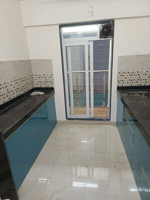 Kitchen in 2 BHK Apartment at Mahavir Square, Manpada – for Rent